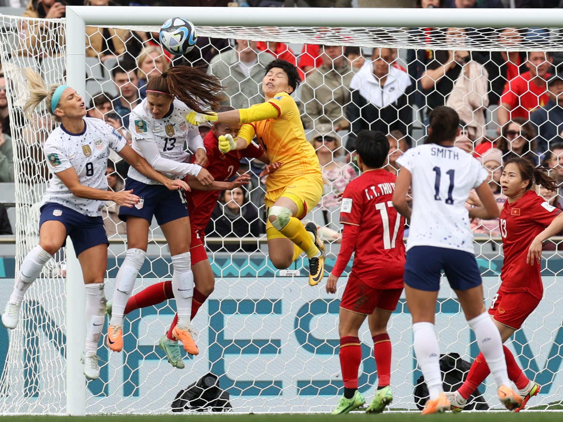Julie Ertz, left, participates in a brawl for the ball during the USA’s Women’s World Cup match against Vietnam on 22 July 2023