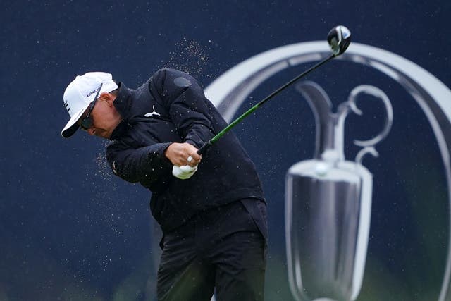 Rickie Fowler tees off the first in the rain during day three of the Open at Royal Liverpool (Peter Byrne/PA)