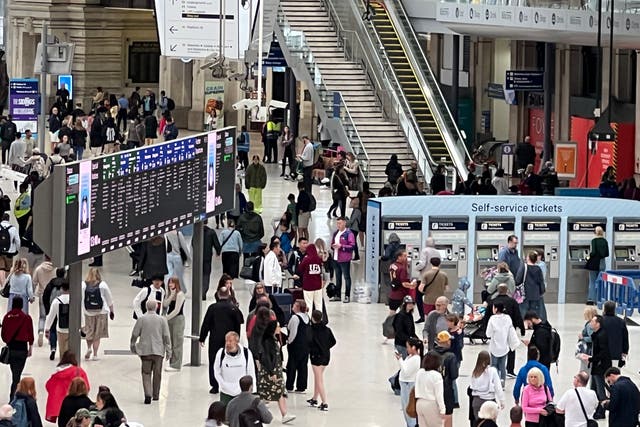 <p>Essential journeys? Passengers at London Waterloo on a strike day</p>