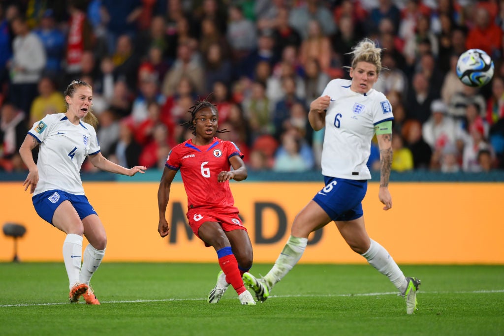 Melchie Dumornay of Haiti shoots while Millie Bright of England attempts to block