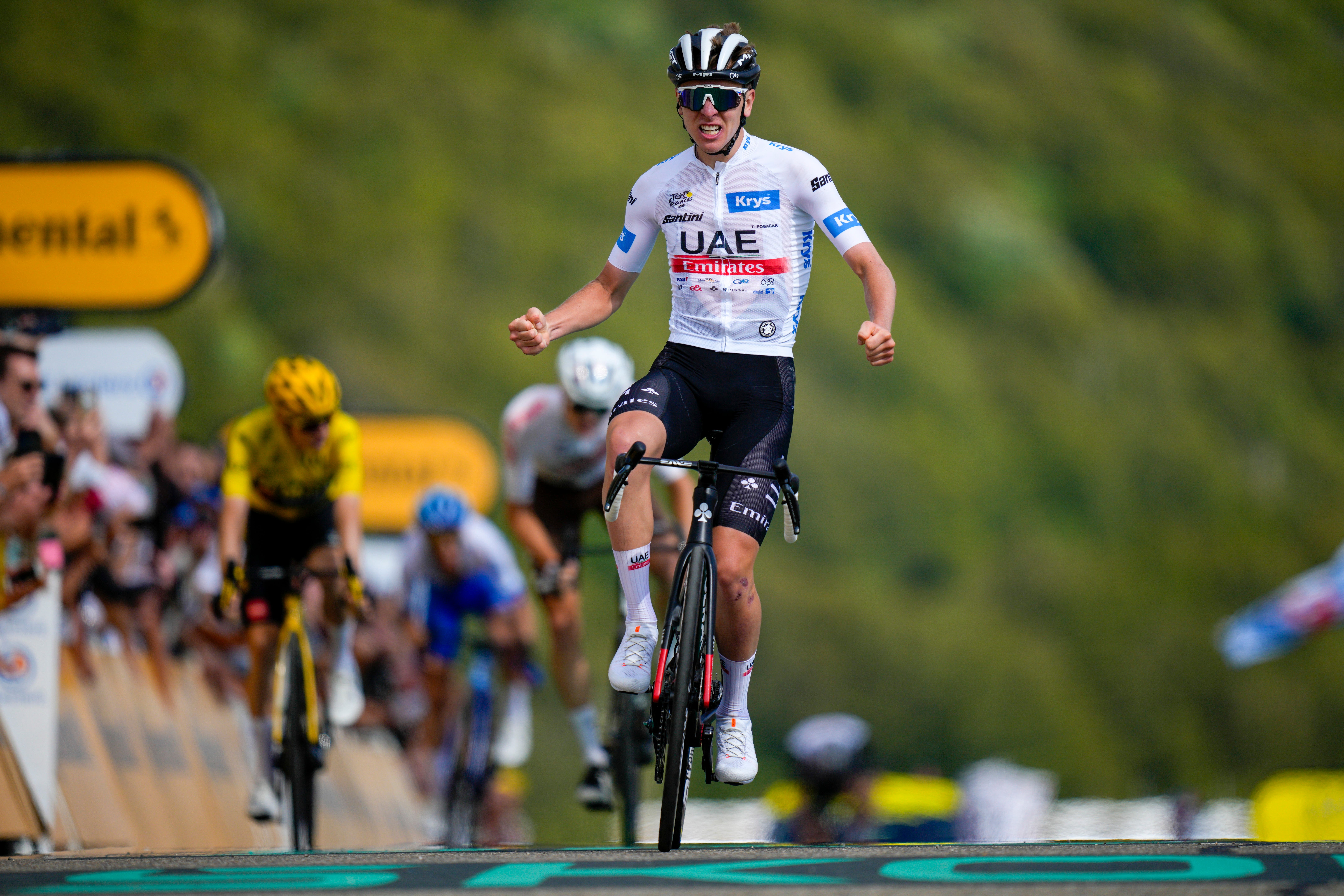 Tadej Pogacar took victory on stage 20 of the Tour de France but it is rival Jonas Vingegaard who will wear yellow in Paris (Daniel Cole/AP)