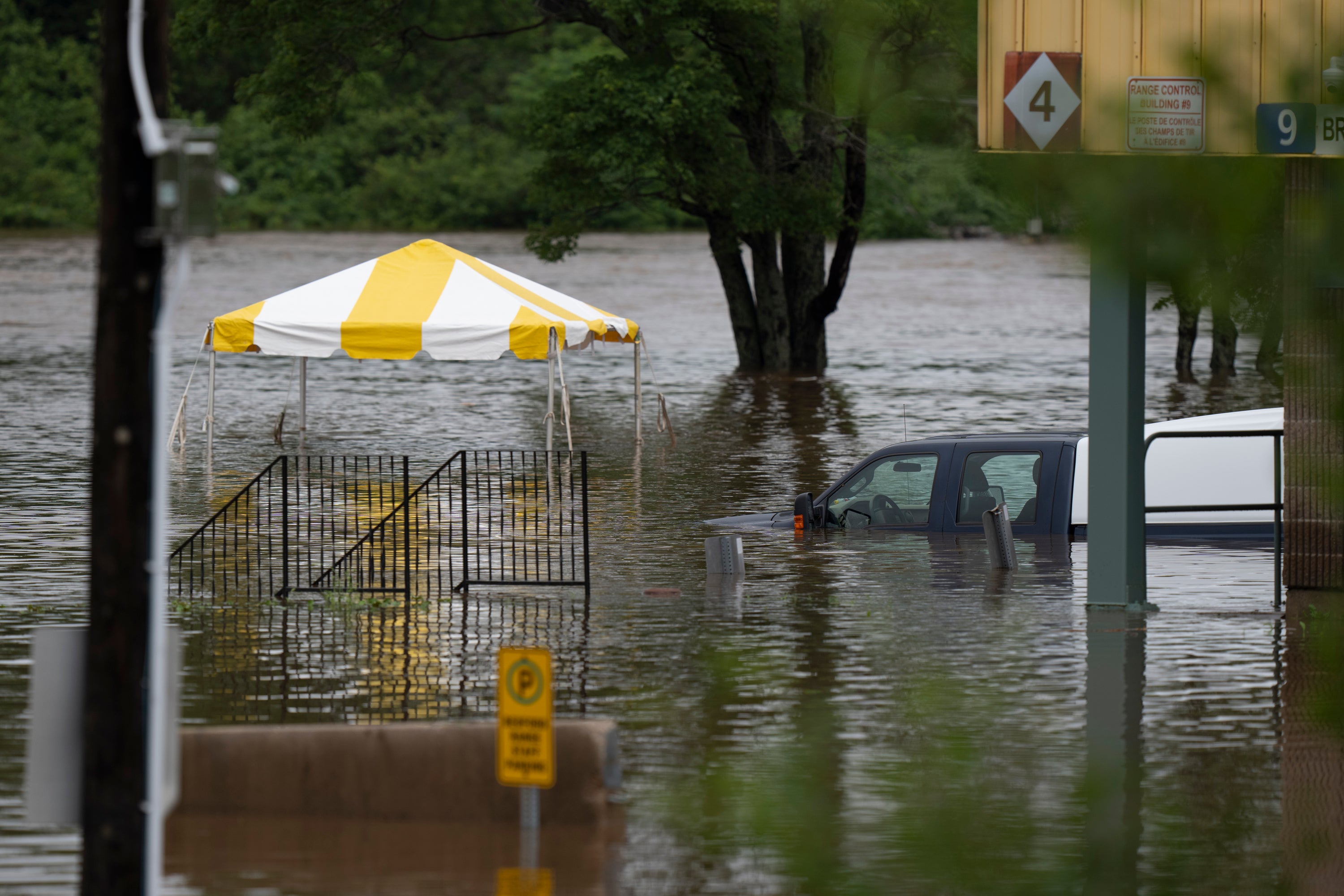 <p>A truck is seen abandoned in floodwater following a major rain event in Halifax on Saturday, July 22, 2023</p>