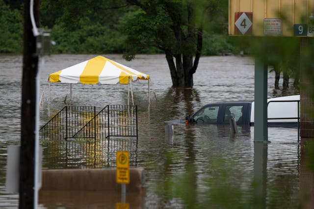 <p>A truck is seen abandoned in floodwater following a major rain event in Halifax on Saturday, July 22, 2023</p>