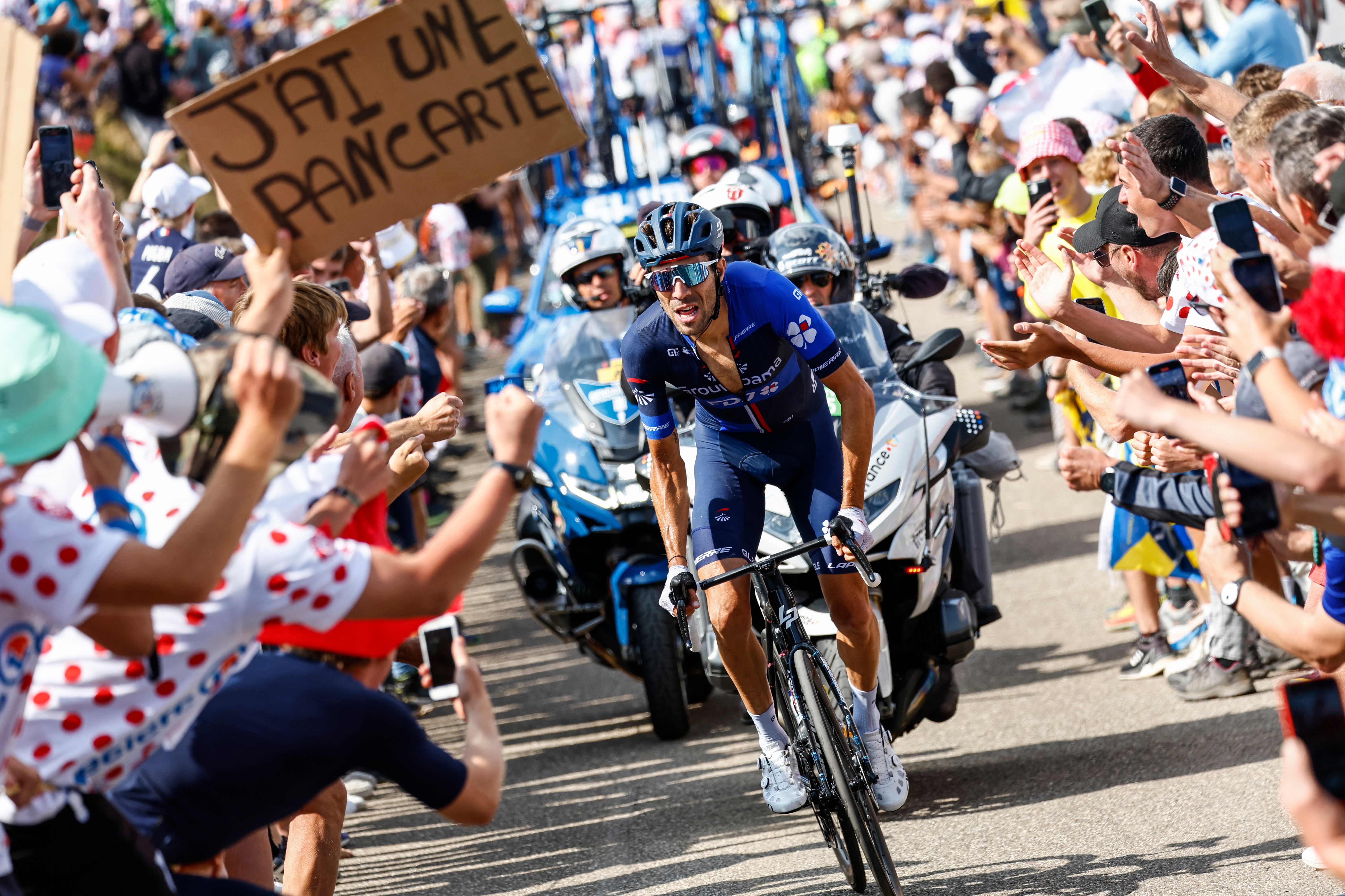 Thibaut Pinot rides through home crowds at the Tour de France
