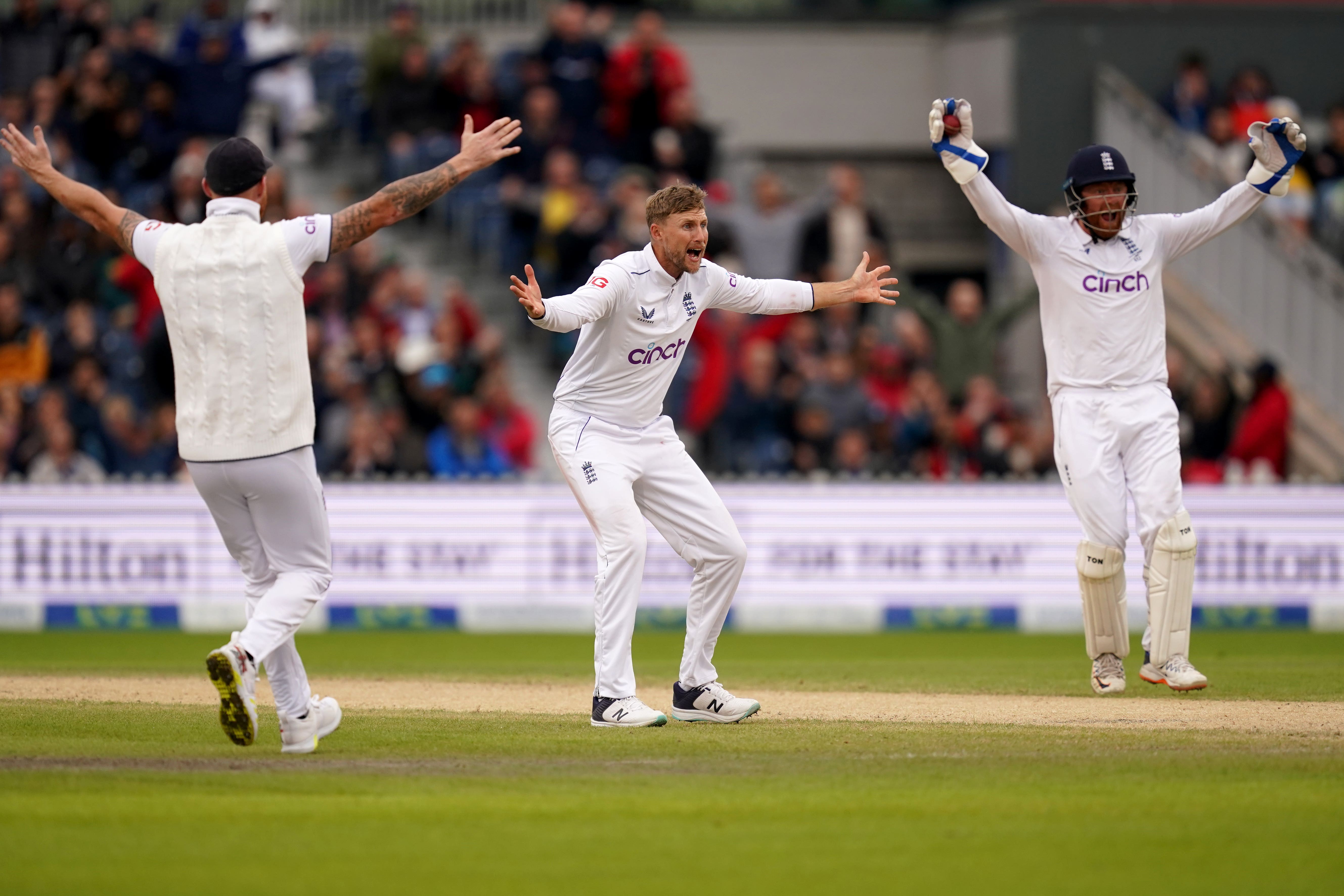 Joe Root’s (centre) part-time spin earned an Australia wicket (Martin Rickett/PA)