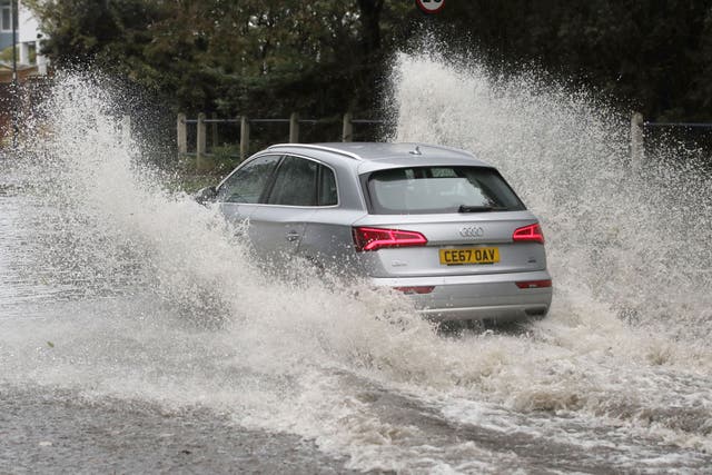 The Met Office said a large band of rain would sit across the central swathe of the UK (Owen Humphreys/PA)