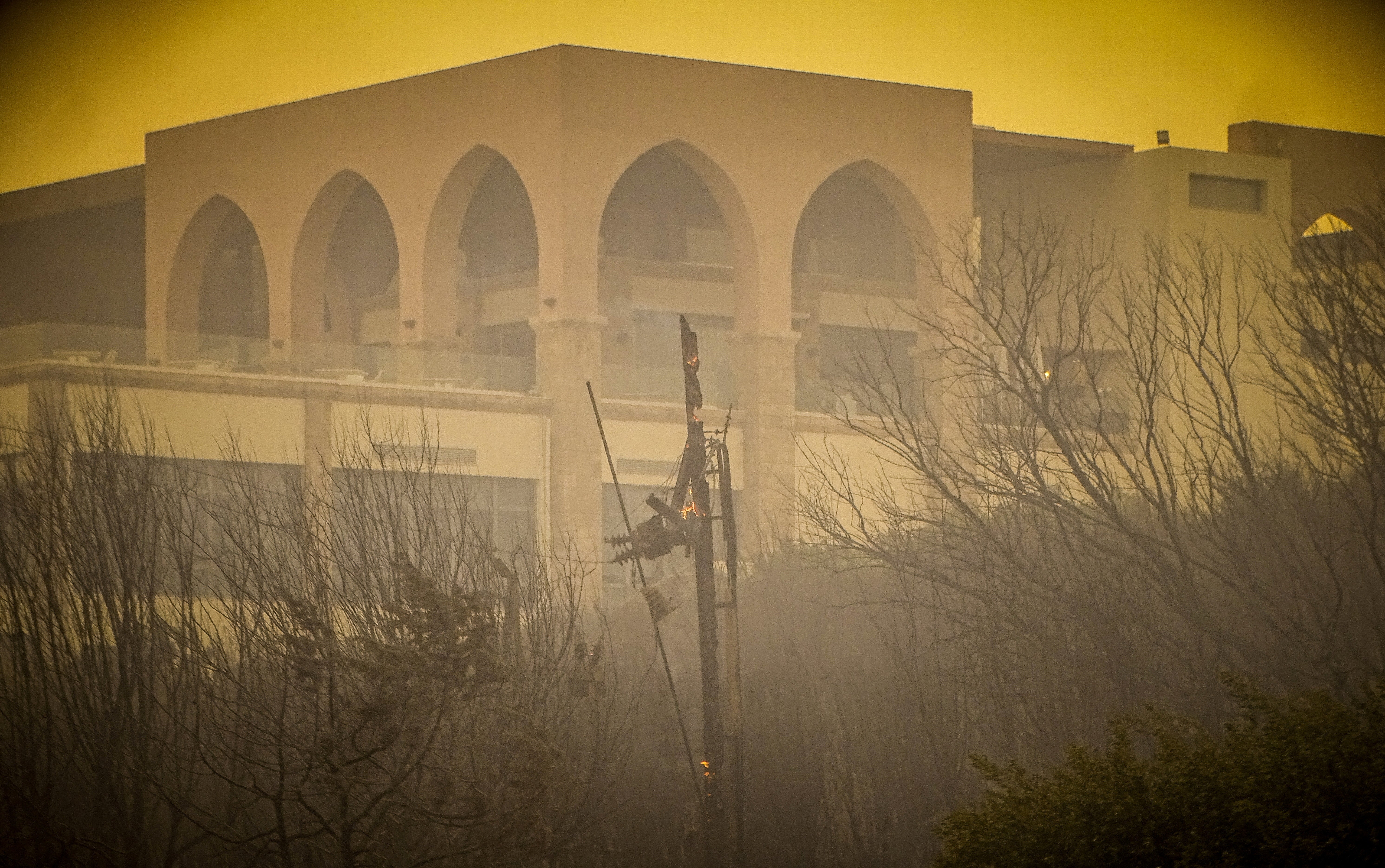 <p>A burnt hotel is seen during a wildfire on the island of Rhodes</p>