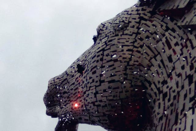 Activists on the top of The Kelpies (This Is Rigged/PA)