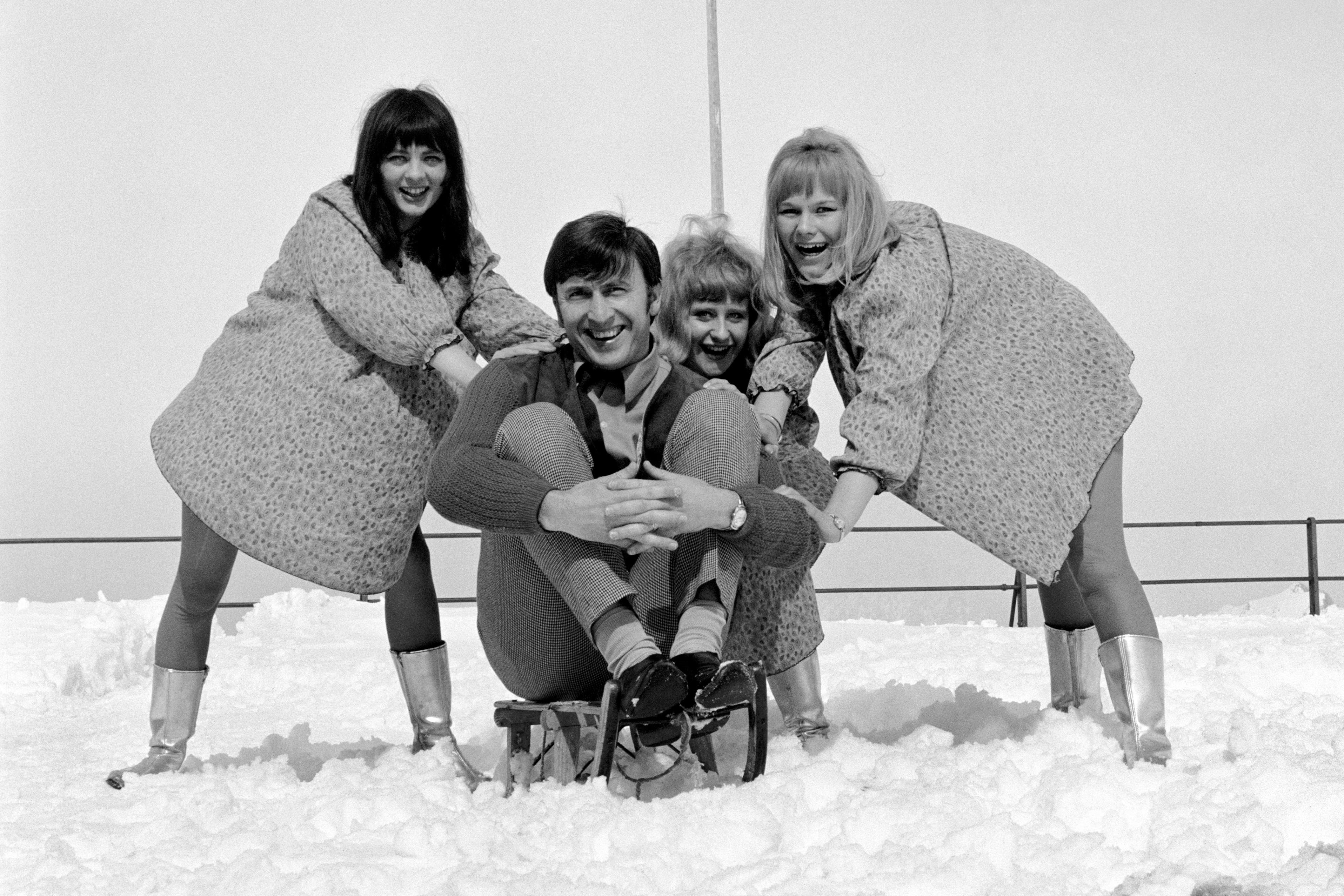 Singer Vince Hill in 1967, when his recording of Edelweiss was high in the charts, enjoying a holiday in the mountains of Switzerland. He is pictured with members of pop group The Dollies (PA)