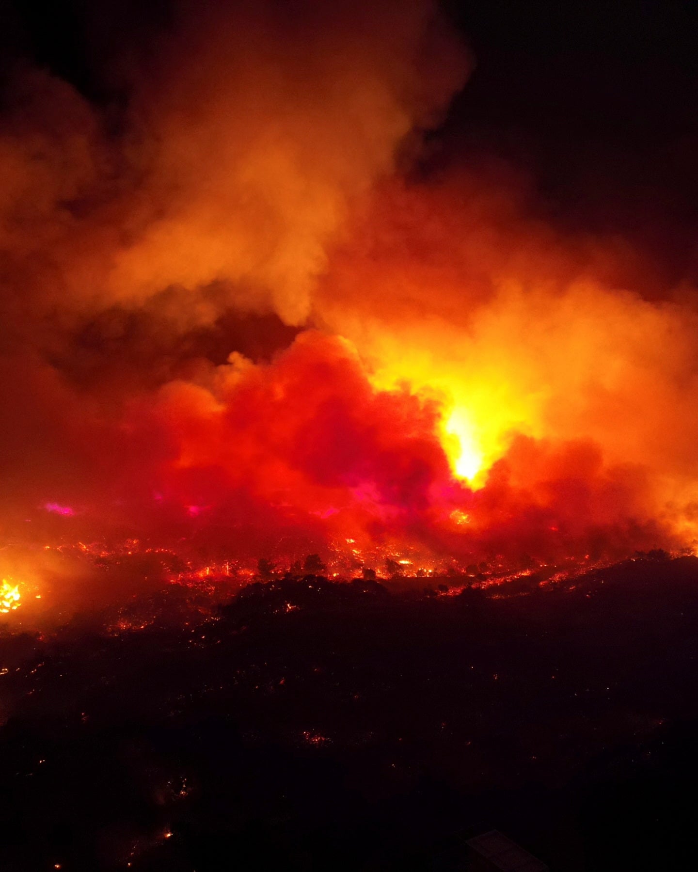 <p>Smoke rises from a wildfire on the island of Rhodes on Sunday </p>