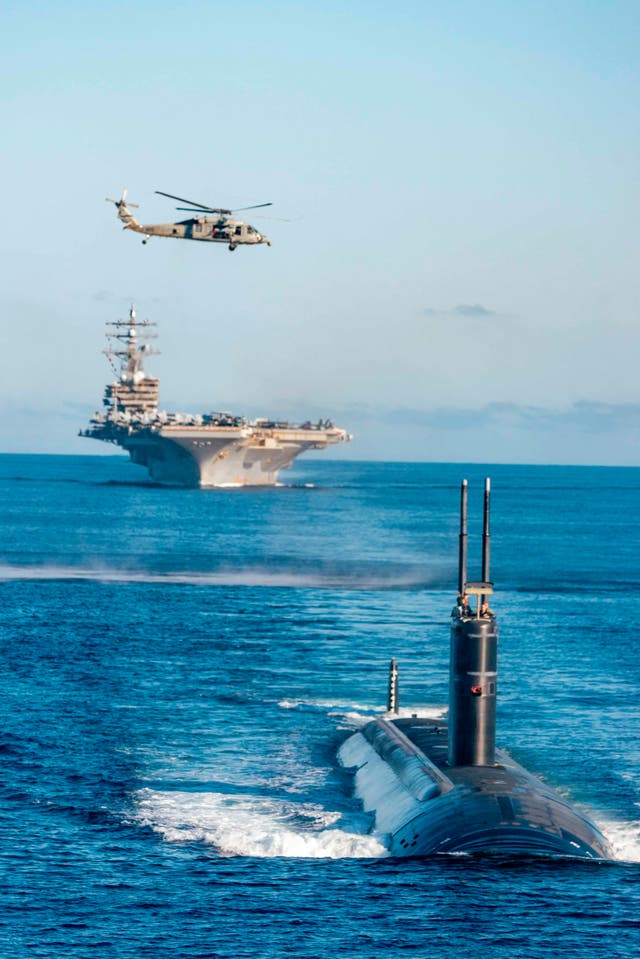 <p>The USS ‘Ronald Reagan’ aircraft carrier and the nuclear-powered submarine USS ‘Annapolis’ participate in a joint anti-submarine drill between South Korea, the United States and Japan in waters off South Korea last year </p>