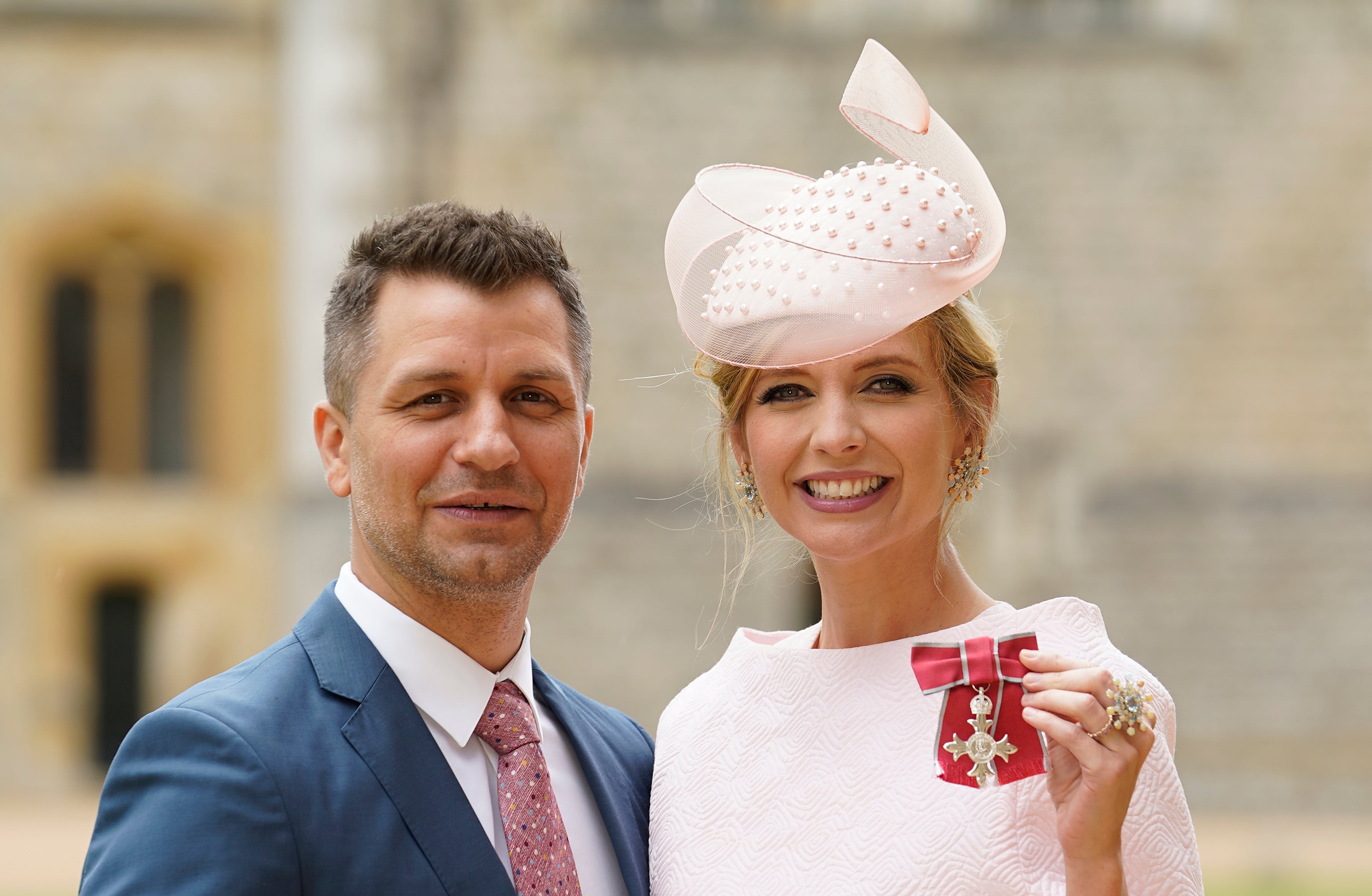 Rachel Riley, with her husband Pasha Kovalev, after she became a Member of the Order of British Empire for services to Holocaust Education, during an investiture ceremony at Windsor Castle on July 11, 2023