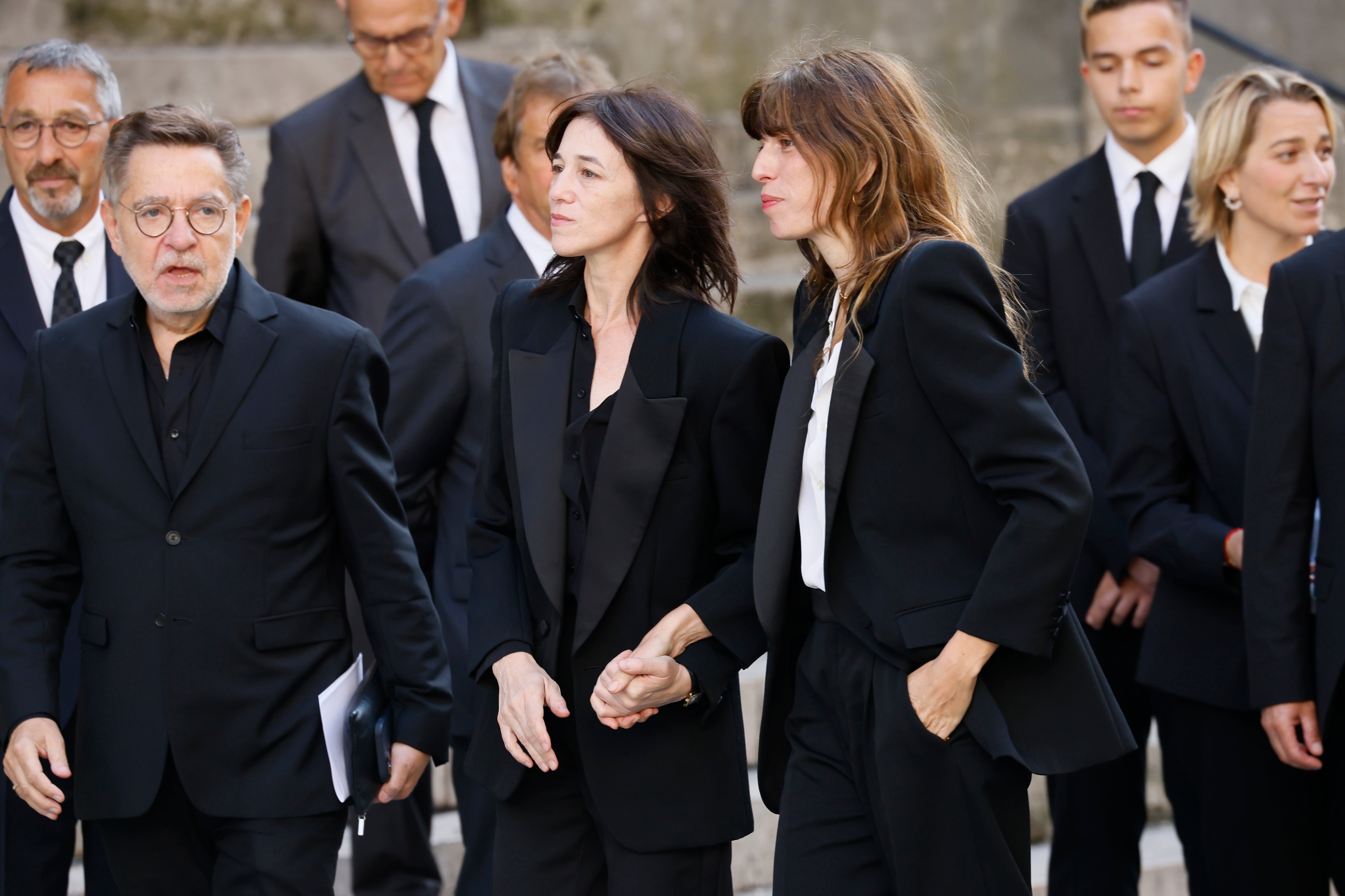 <p>Jane Birkin’s daughters Charlotte Gainsbourg, center, and Lou Dillon, center right, arrive at Jane Birkin’s funerals ceremony</p>