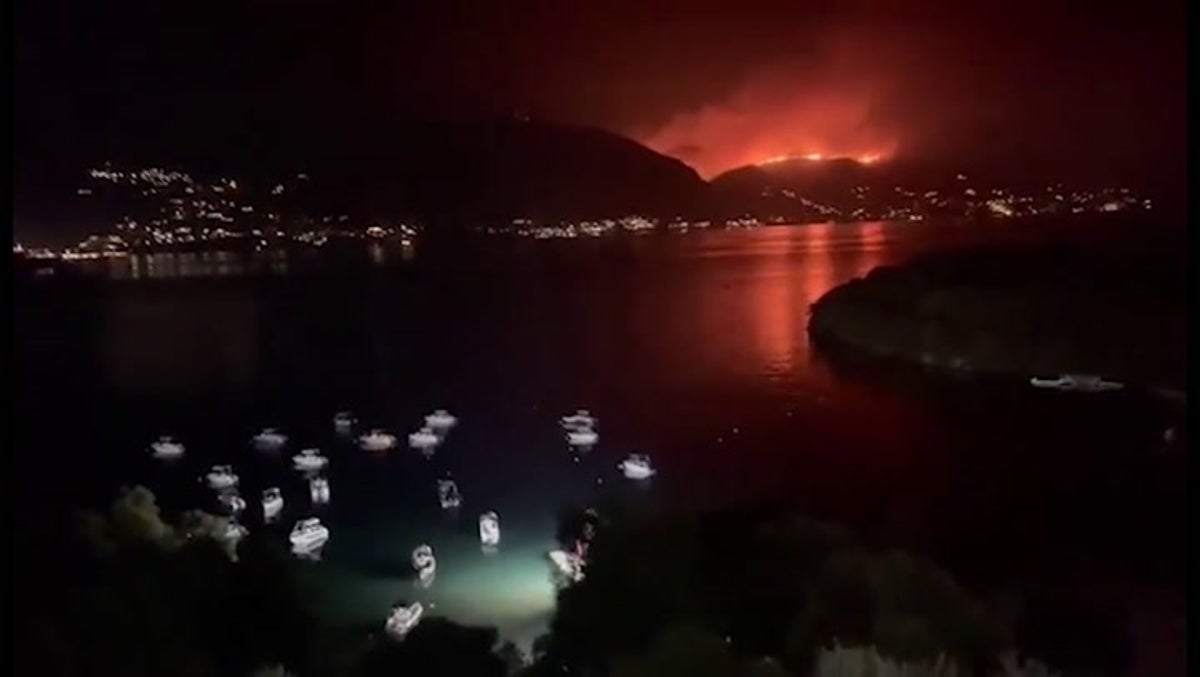 Corfu sky glows orange as wildfires force islanders to evacuate