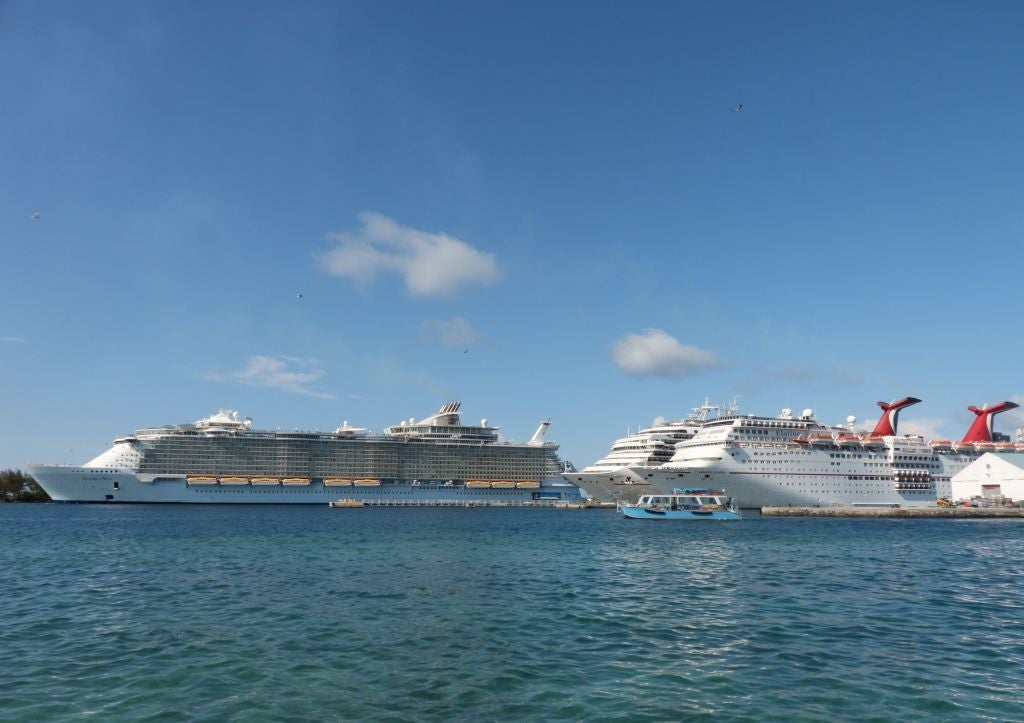 The Carnival Elation cruise ship is pictured (right) in a file photo