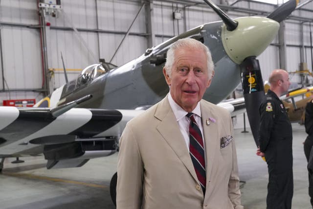The King paid tribute to RAF veterans on a visit to the home of the Battle of Britain Memorial Flight (Arthur Edwards/The Sun/PA)