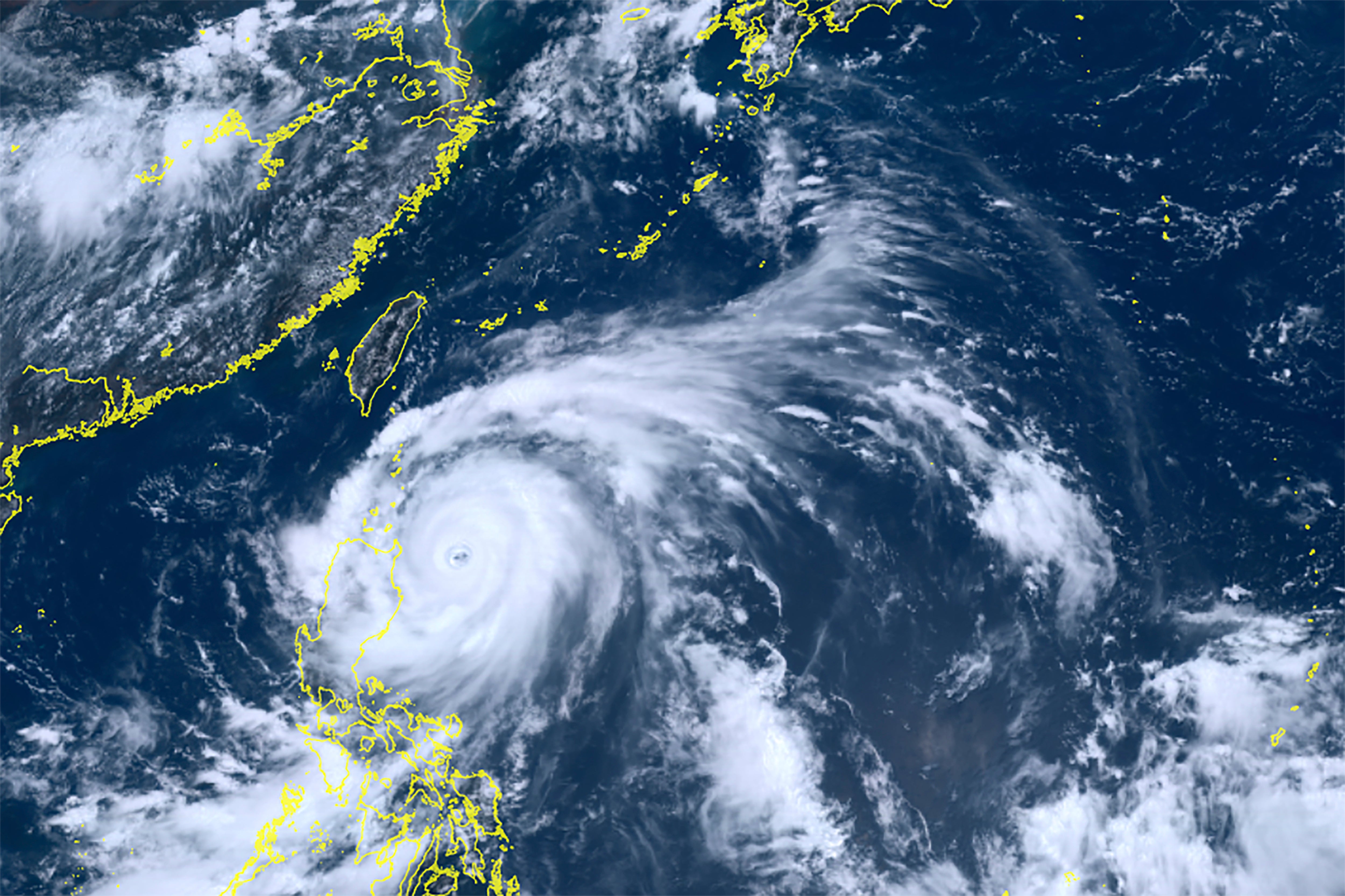 This satellite image taken by Himawari-8, a Japanese weather satellite, and provided by National Institute of Information and Communications Technology, shows Typhoon Doksuri near the northern Philippines Tuesday