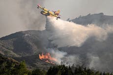 Greece fires – live: Thousands flee Rhodes and Corfu as Sicily airport now forced to close