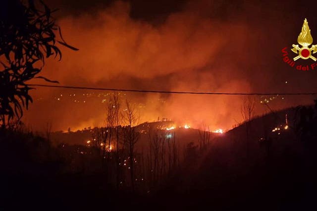 <p>Flames and smoke rise as a wildfire burns near the Sicilian village of Curcuraci near Messina, Italy</p>