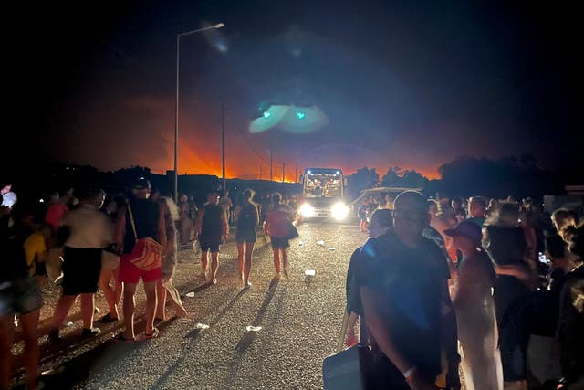 People have been evacuated from hotels in Rhodes as fires sweep through parts of the Greek island (Ian Murison/AP)