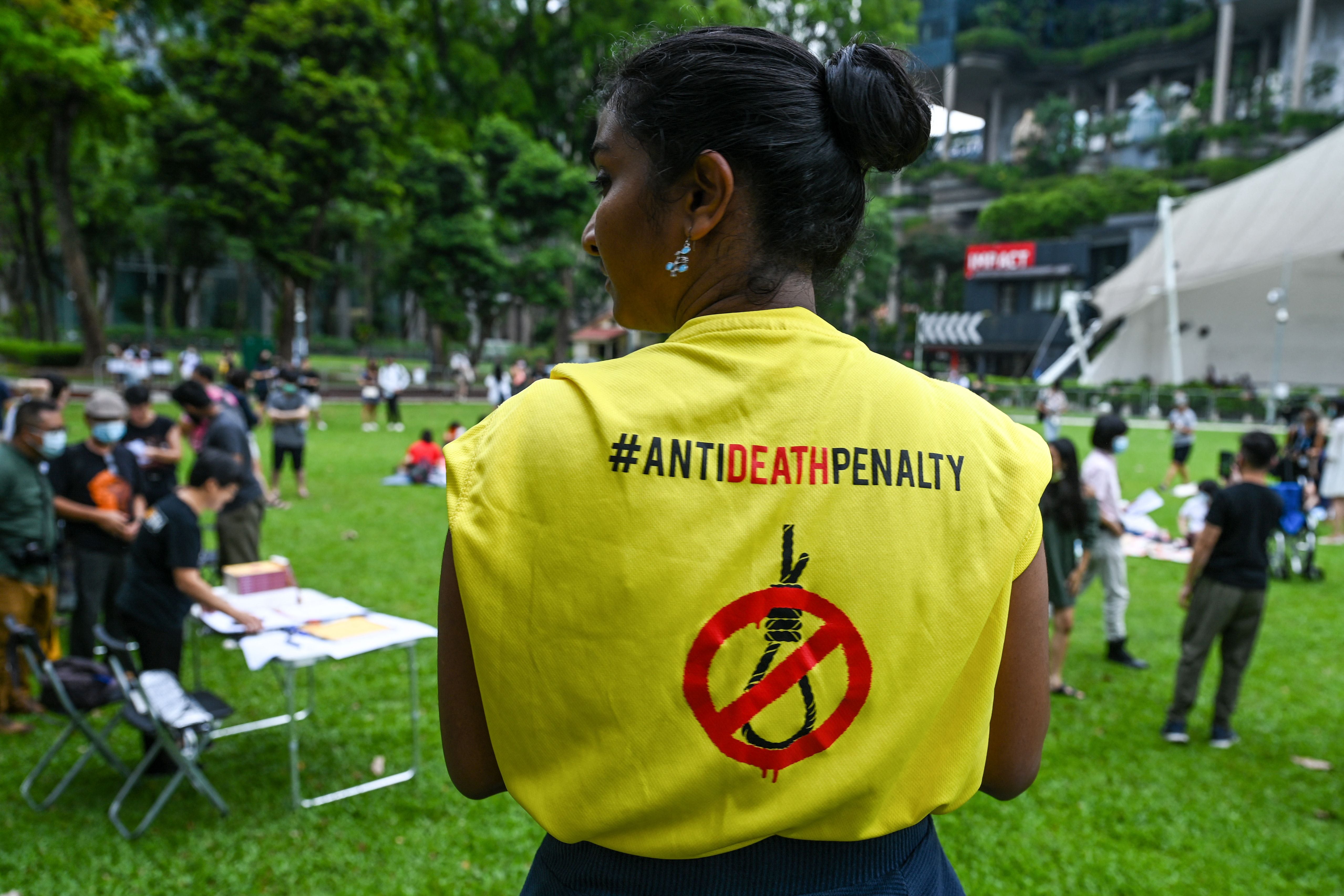 <p>An activist wears a T-shirt with a sign against the death penalty during a protest against the death penalty</p>