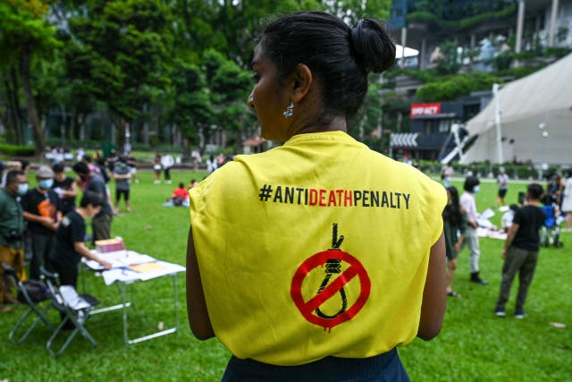 <p>An activist wears a T-shirt with a sign against the death penalty during a protest against the death penalty</p>