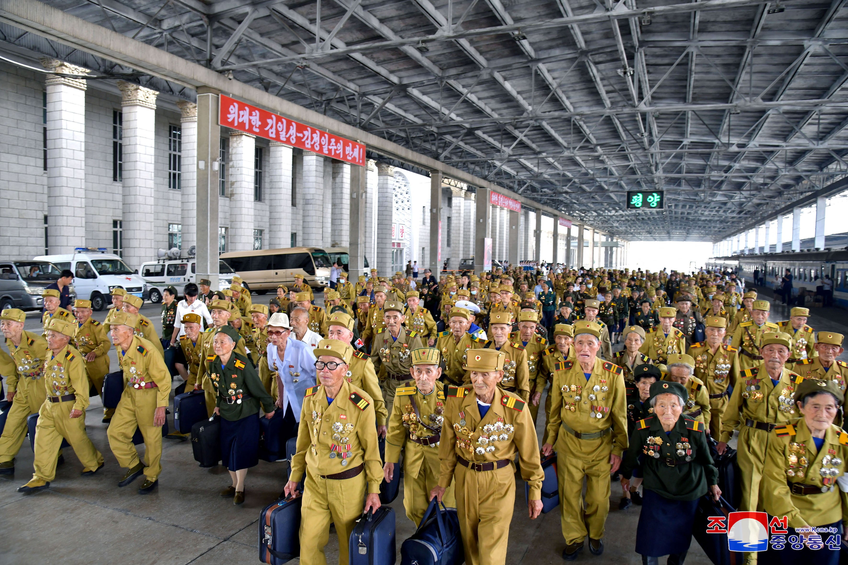 Participants attending the 70th anniversary commemorations of the Korean War armistice arrive in Pyongyang