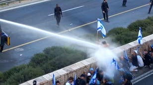 Israeli police fire water cannon at crowd protesting judicial overhaul