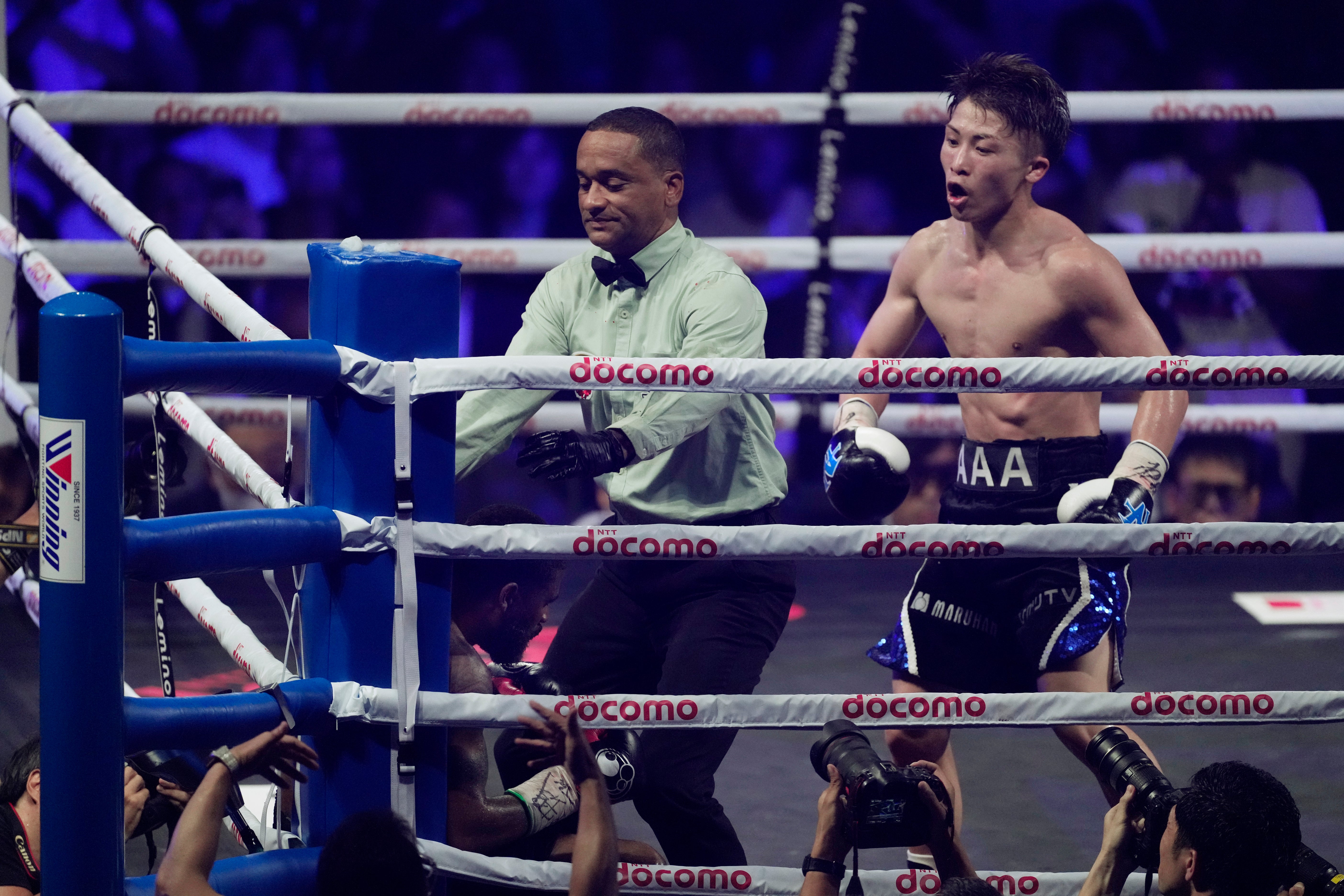 The referee waves off the fight after Inoue pummels Fulton with hooks in the corner