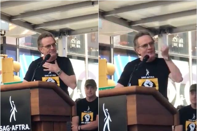 <p>Bryan Cranston delivers a speech at the NYC SAG-AFTRA strike rally.</p>