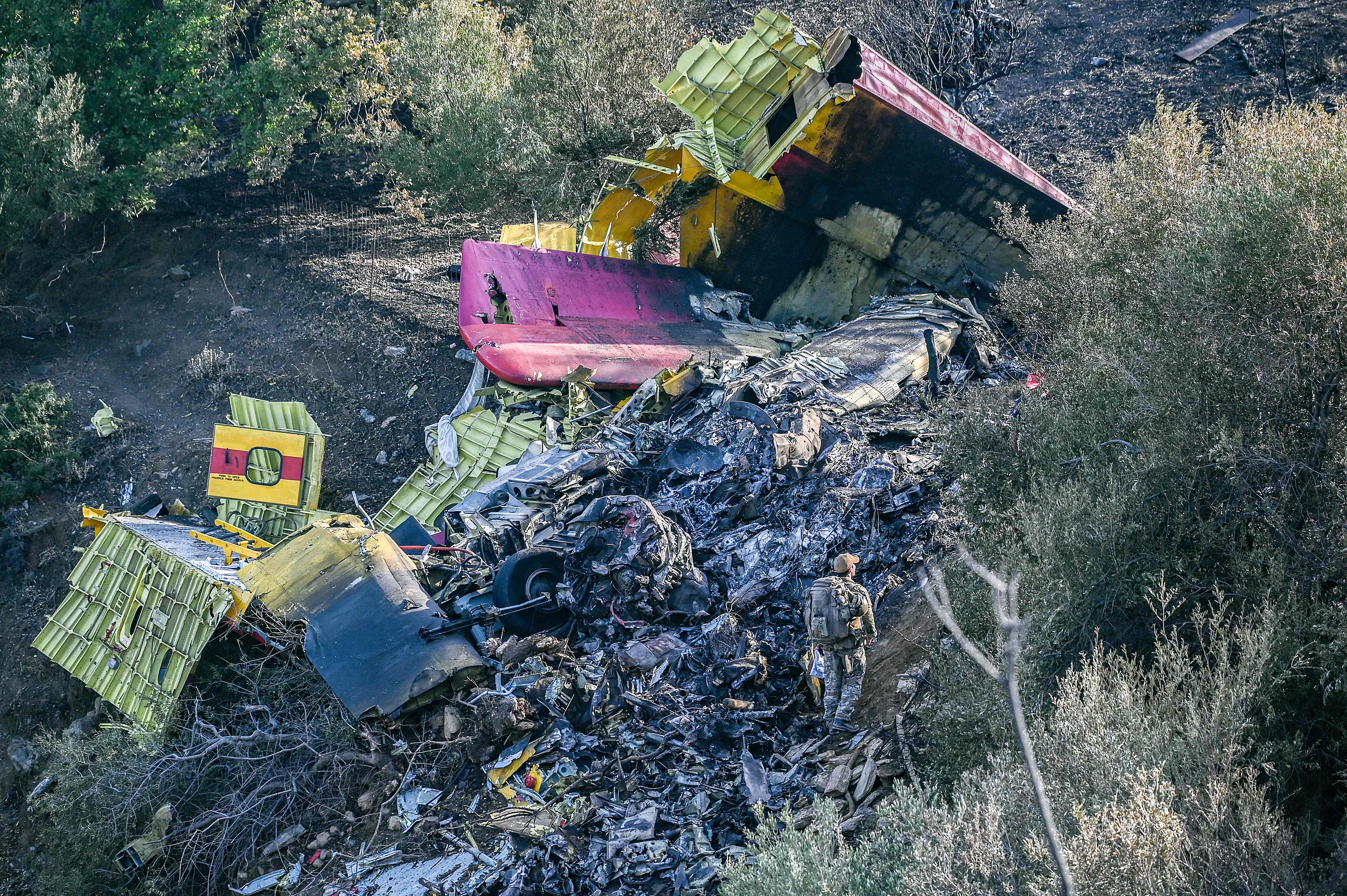 Debris of a Canadair CL-215 firefighting aircraft, which crashed near while being flown to fight a wildfire in Karystos, on the Greek Aegean island of Evia, on July 25, 2023.