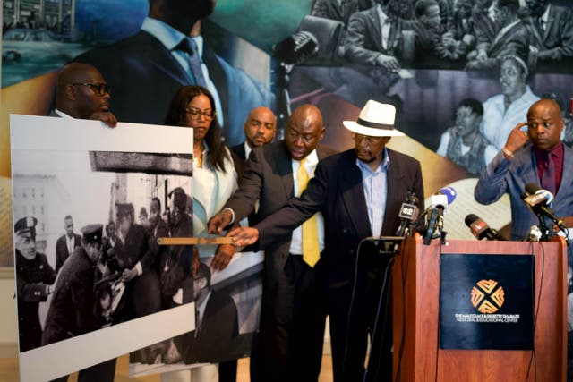<p>Mustafa Hassan points to himself in a photo from the day Malcolm X was assassinated </p>