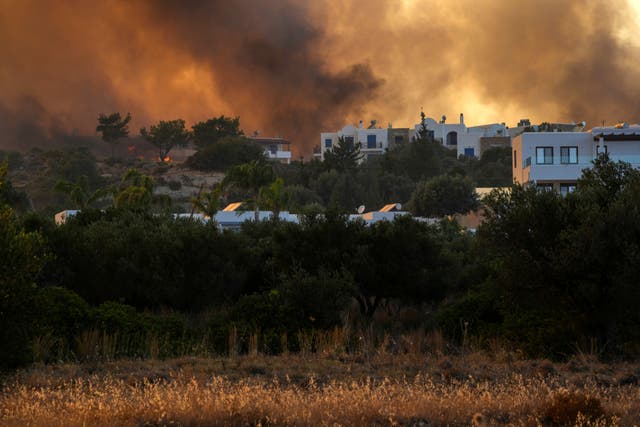 A wildfire burns in Gennadi village (Petros Giannakouris/AP)