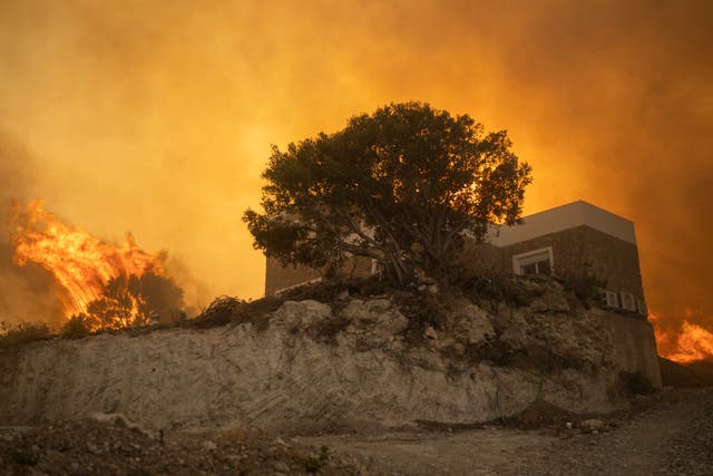 <p>A wildfire burns in Gennadi village, on the Aegean Sea island of Rhodes, southeastern Greece. </p>