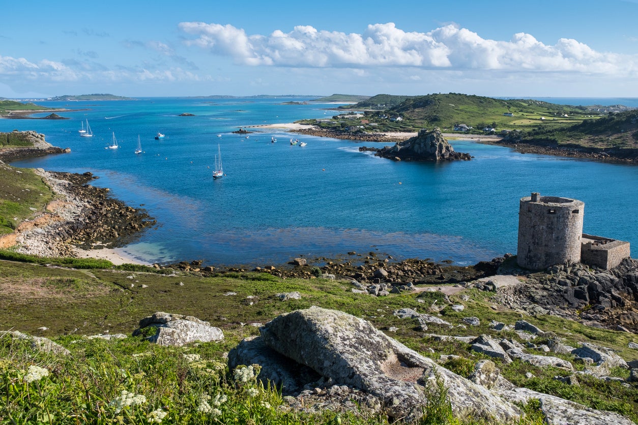A view over part of Tresco, showing Cromwell’s Castle and the Isle of Bryher
