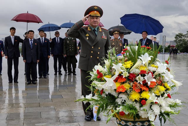 <p>Russian defence minister Sergei Shoigu visiting the statues of the late North Korean leaders Kim Il Sung and Kim Jong Il in Pyongyang </p>