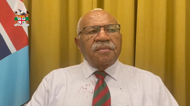 <p>Fiji’s prime minister, Sitiveni Rabuka, appears in video with blood-stained clothes and bandage on head to announce cancellation of China trip </p>