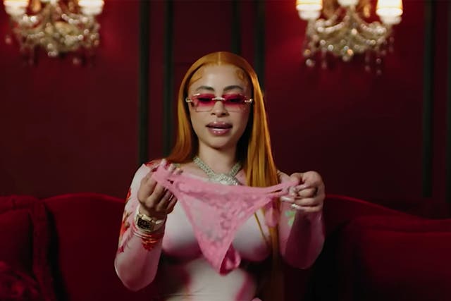 <p>Ice Spice pulls a spare pair of pink underwear out of her handbag in a video for ‘Vogue’ </p>