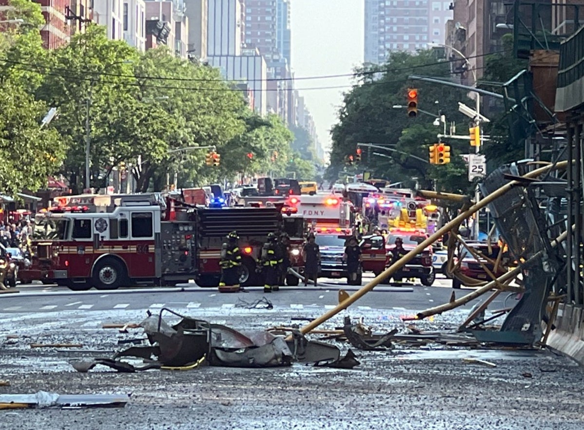 New York City crane collapse – live: Manhattan high rises evacuated after crane catches fire and collapses