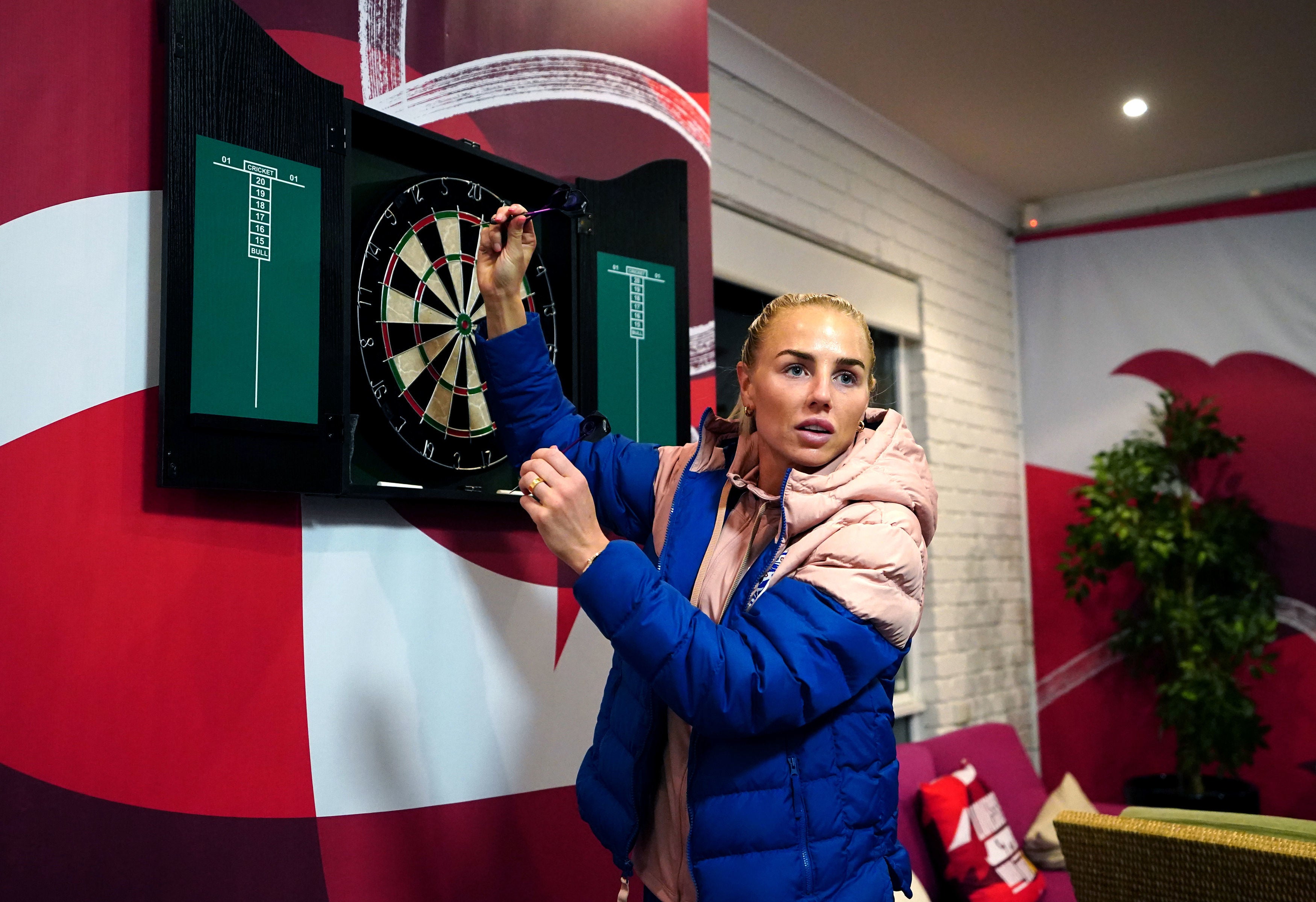 England’s Alex Greenwood in action on the darts board