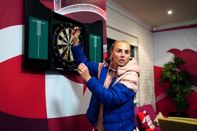 <p>England’s Alex Greenwood in action on the darts board</p>