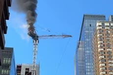 Terrifying video shows crane crashing into Manhattan skyscraper after catching fire