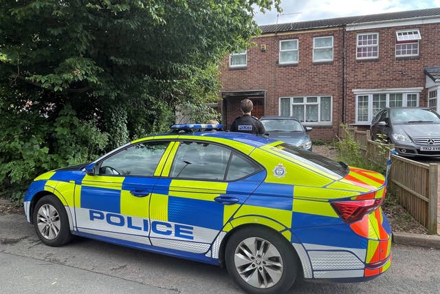 Police outside a property in Hopyard Close, Leicester, after a five-year-old boy and a man aged 41 were found dead (Matthew Cooper/PA)
