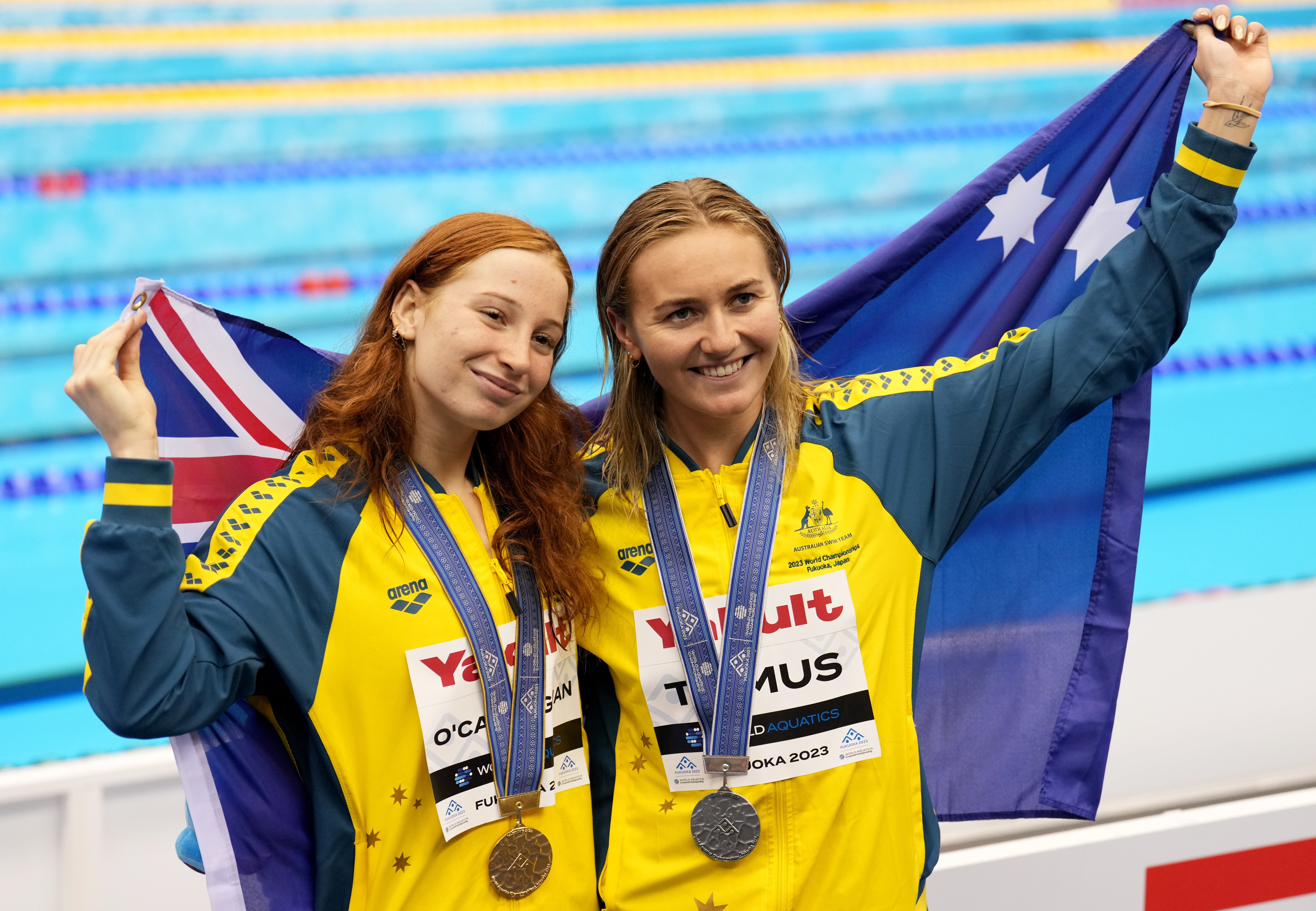 Mollie O’Callaghan and Ariarne Titmus of Australia celebrate with their medals at the World Aquatics Championship