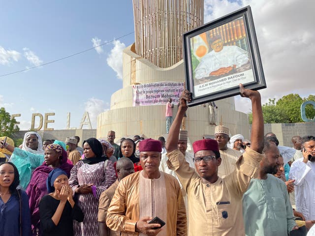 <p>Supporters of Niger president Mohamed Bazoum gather to show their support for him in Niamey on 26 July 2023</p>