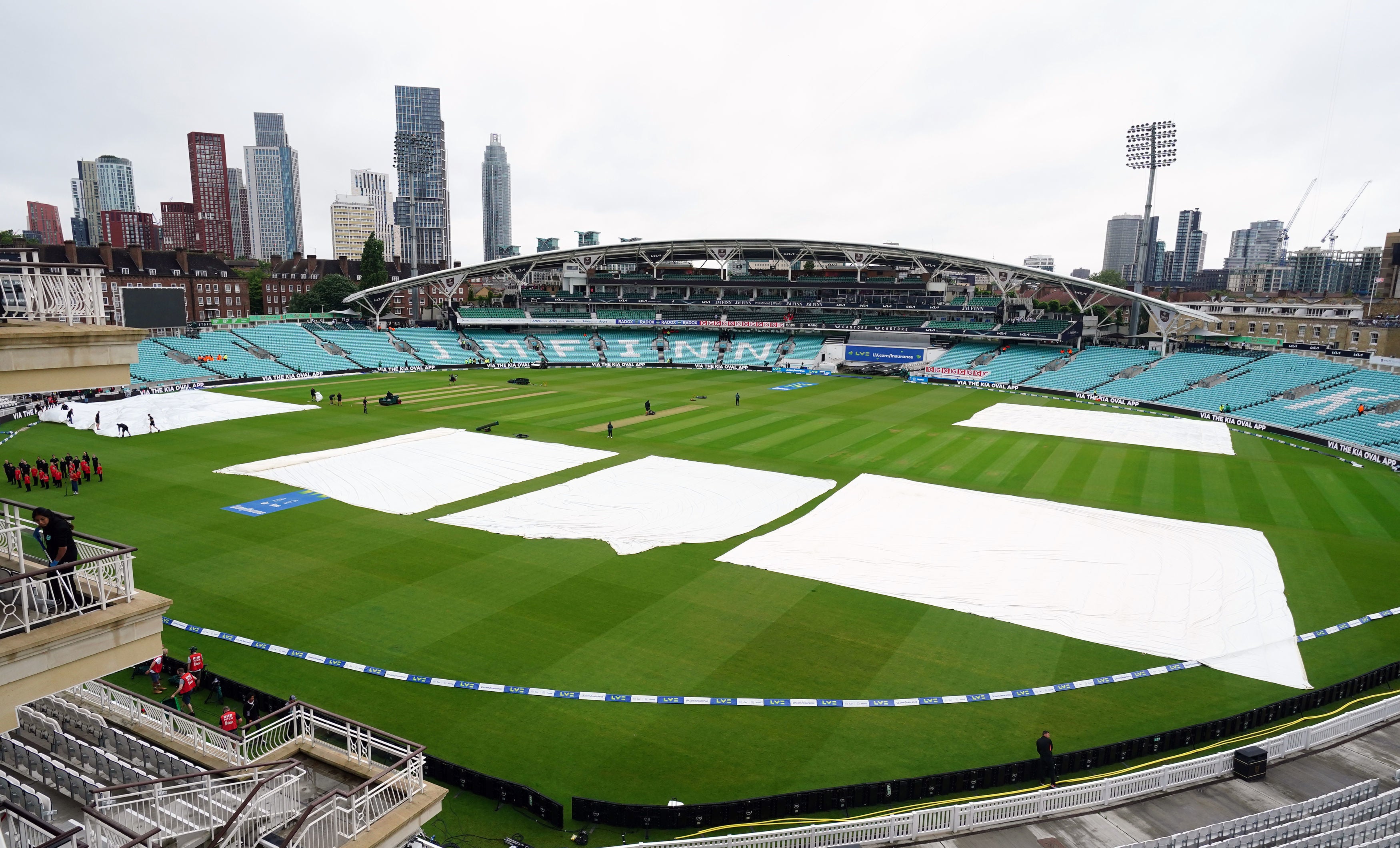 <p>Rain covers protect the wicket in the hours before the fifth Test begins</p>