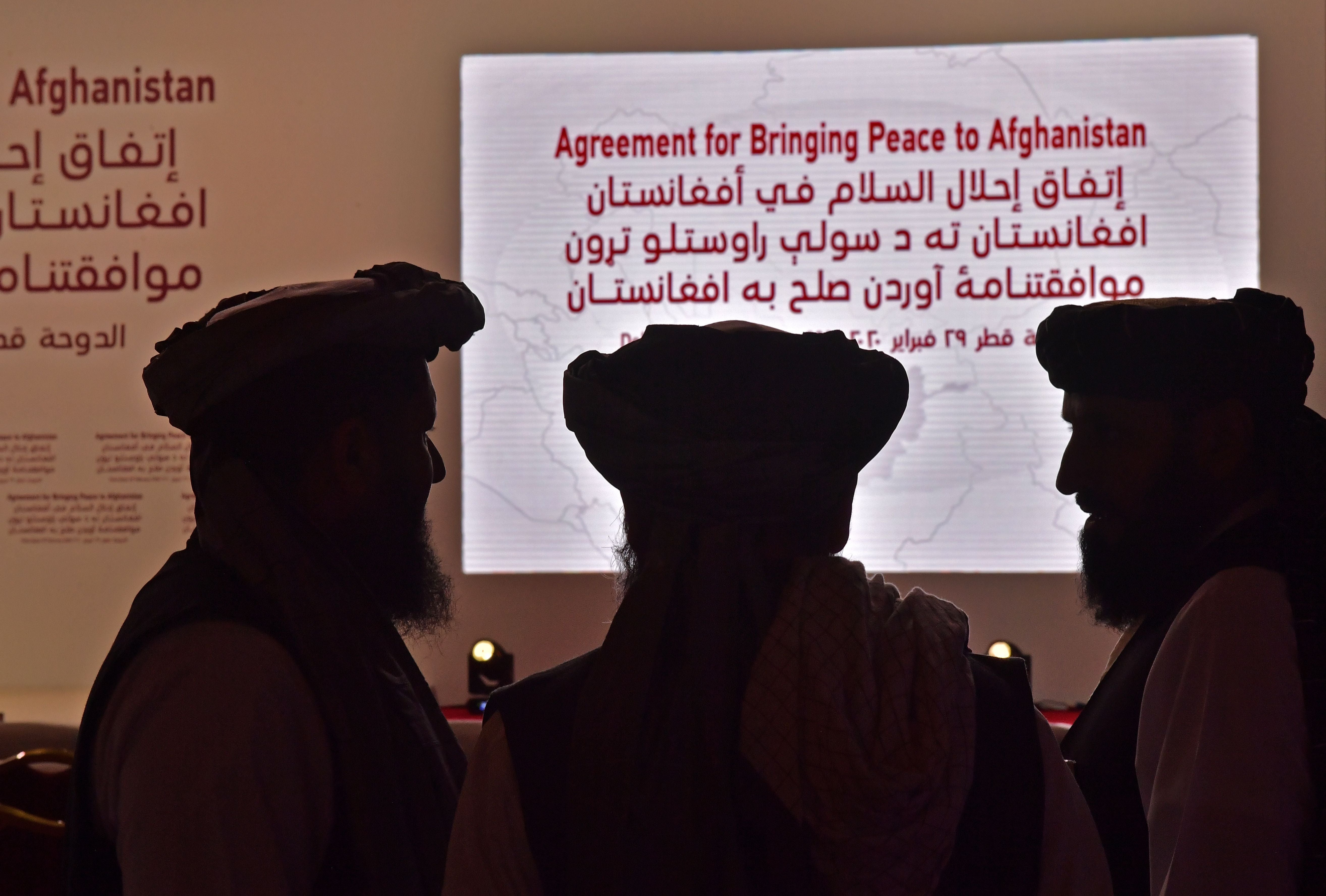 File: Members of the Taliban delegation gather ahead of the signing ceremony with the United States in the Qatari capital Doha in 2020