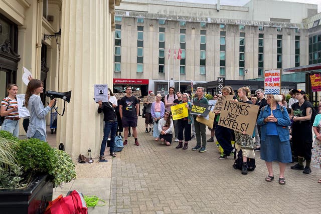 People gather outside Brighton Town Hall in June in support of Brighton and Hove City Council’s plan to launch legal action against the Home Office for reopening a hotel where more than 100 unaccompanied asylum-seeking children went missing (Anahita Hossein-Pour/PA)