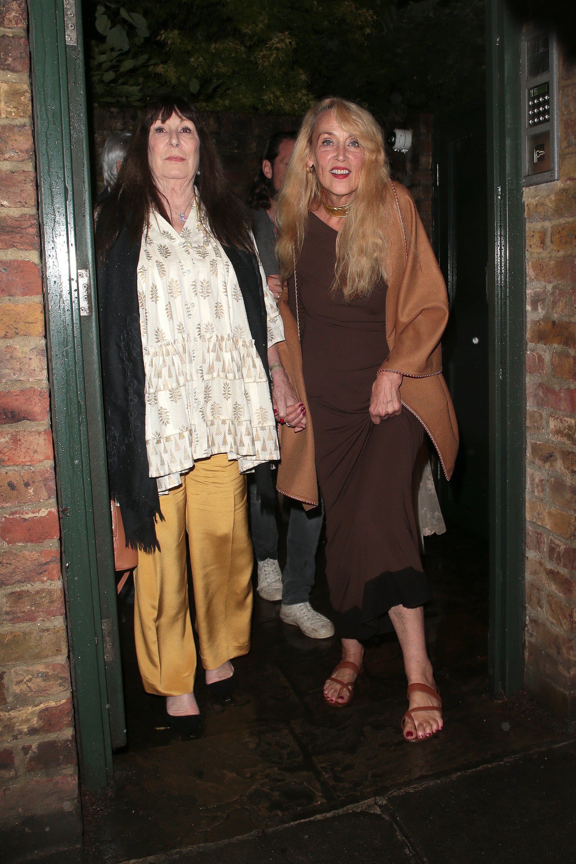 Anjelica Huston and Jerry Hall leaving Mick Jagger’s birthday party