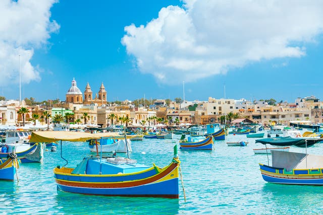 <p>Boats bobbing in Marsaxlokk harbour, Malta </p>